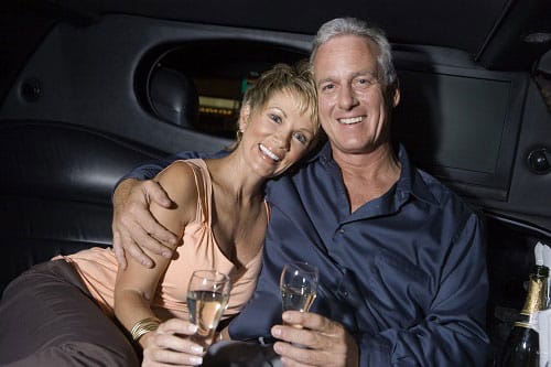 Anniversary Couple in Limo Couple in the back of a limousine enjoying a glass of wine